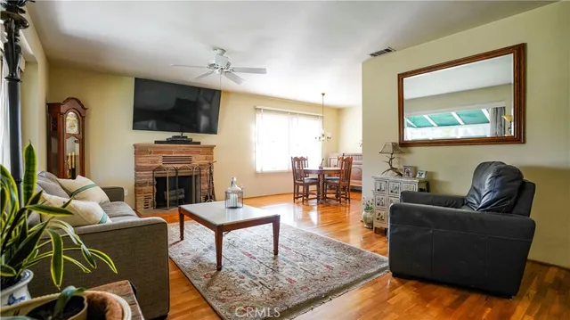 a living room with furniture a rug and a fireplace