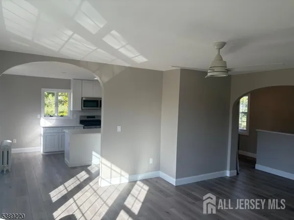 a view of a living room and dining room