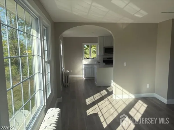 a view of livingroom with furniture and window