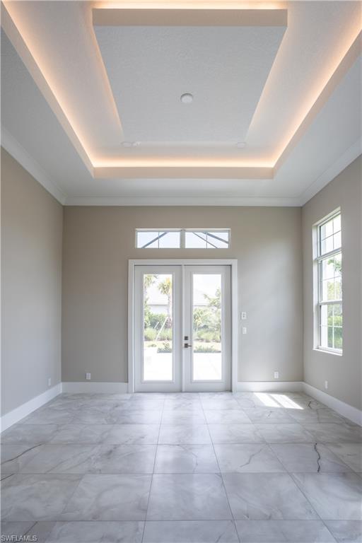 9475 Caymas Way Naples, FL 34114 - Photo 7 of 8 a view of an empty room with a window