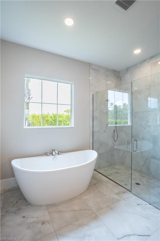 9475 Caymas Way Naples, FL 34114 - Photo 8 of 8 a bathroom with a bathtub and shower