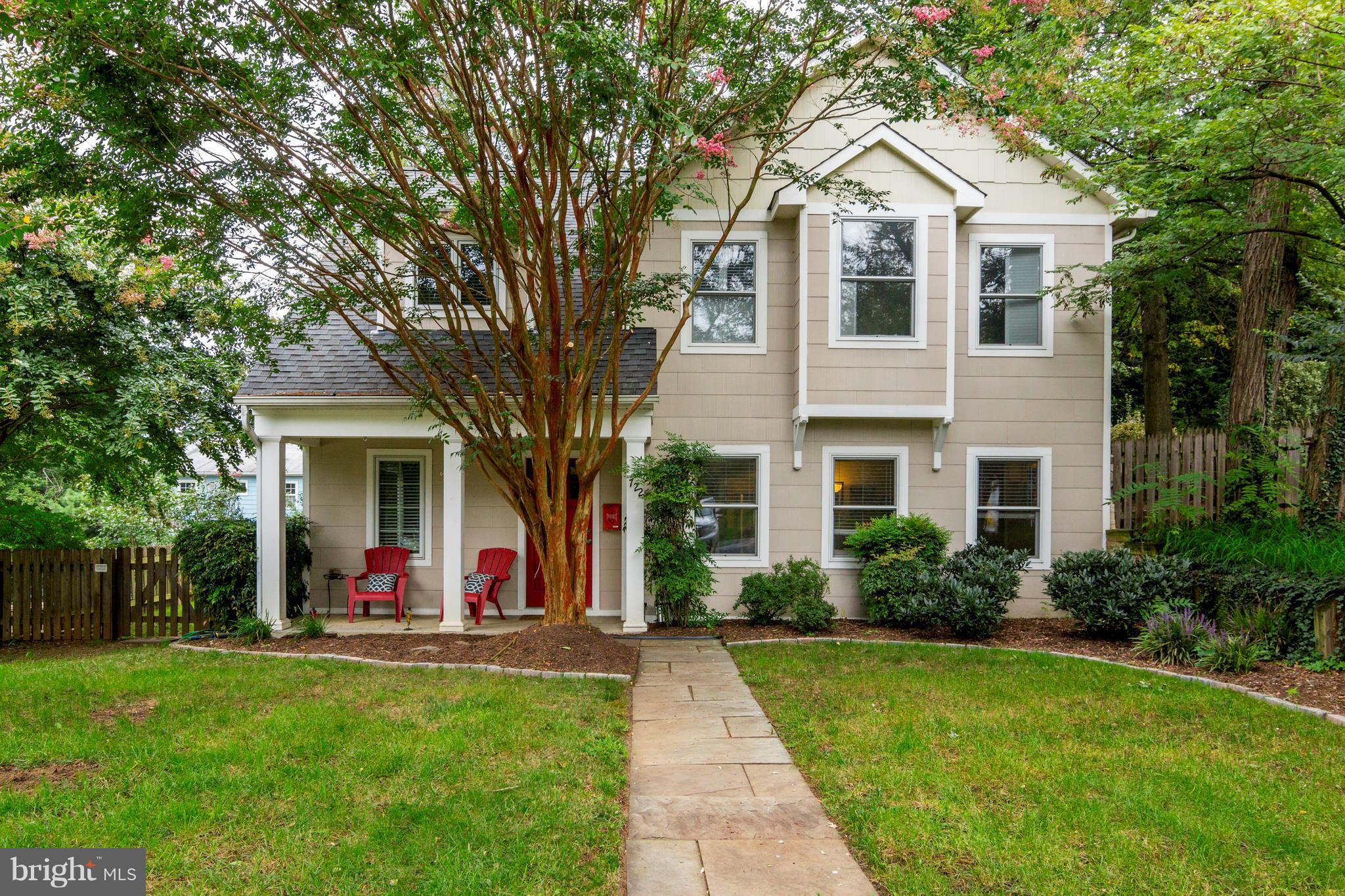 722 Genessee Street Annapolis, MD 21401 - Photo 1 of 29 a view of a white house with a big yard and potted plants and large trees