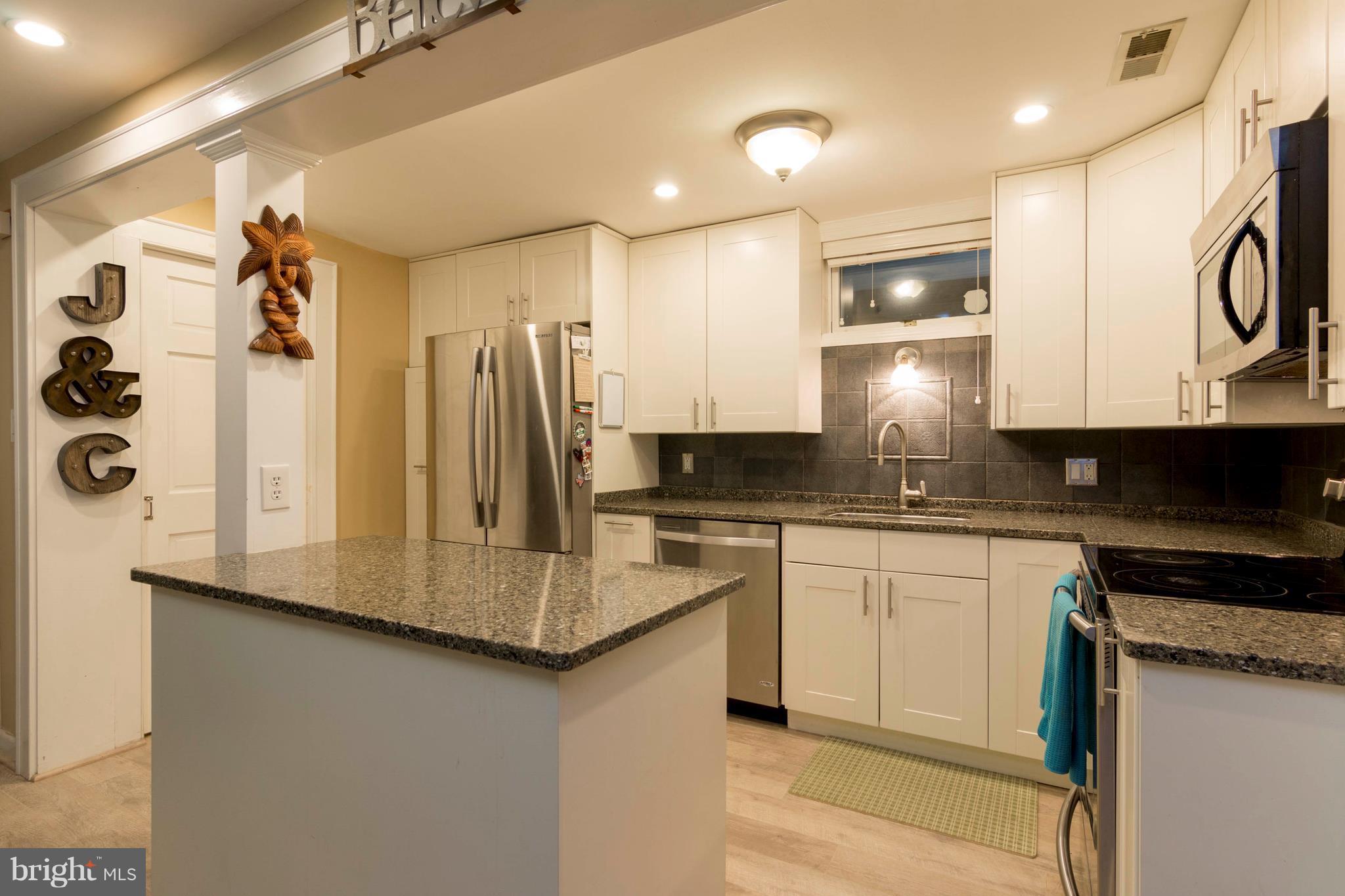 722 Genessee Street Annapolis, MD 21401 - Photo 12 of 29 a kitchen with stainless steel appliances granite countertop a refrigerator a stove and a sink