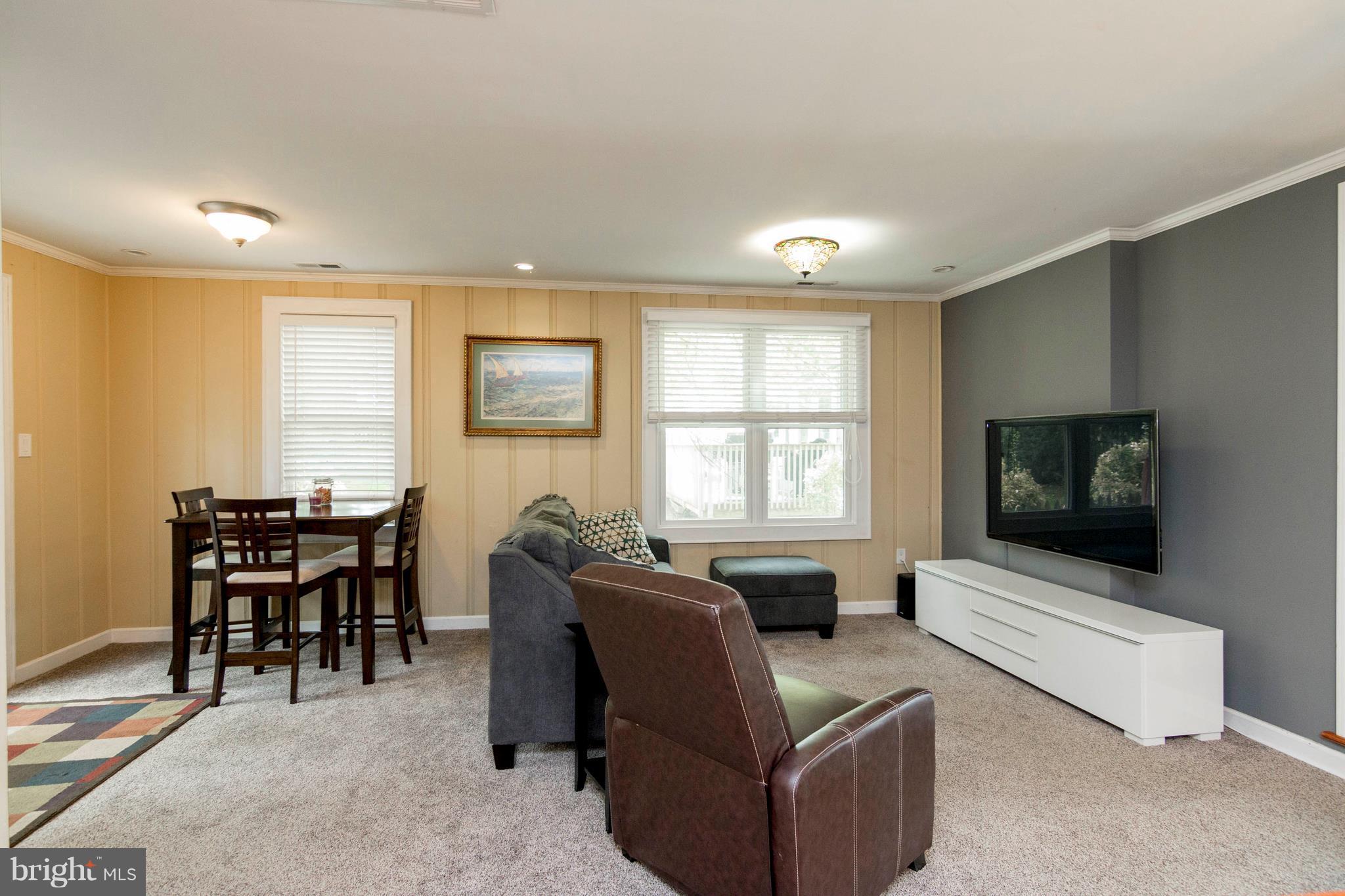 722 Genessee Street Annapolis, MD 21401 - Photo 17 of 29 a living room with furniture and a flat screen tv