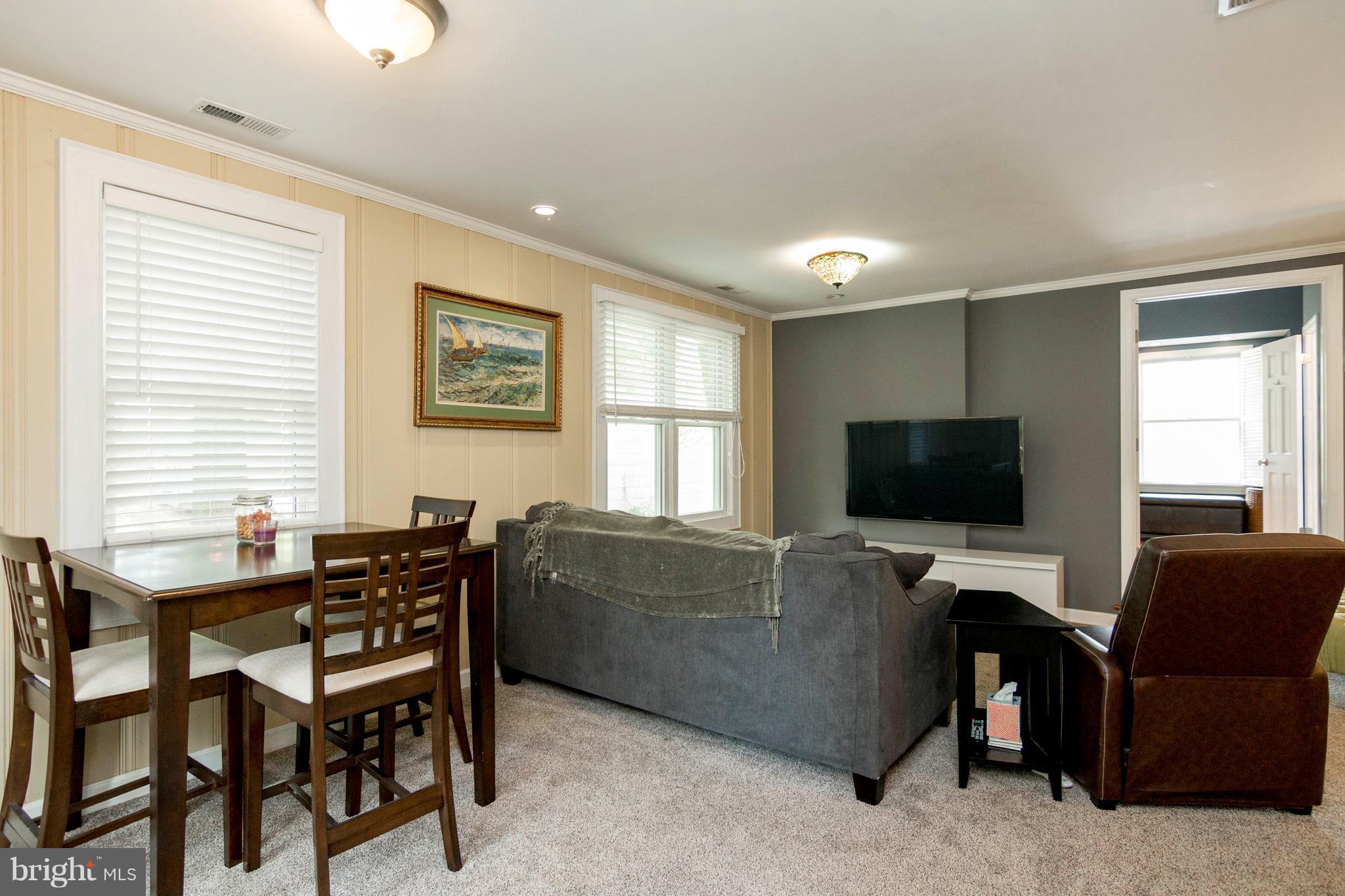 722 Genessee Street Annapolis, MD 21401 - Photo 19 of 29 a living room with furniture and a flat screen tv