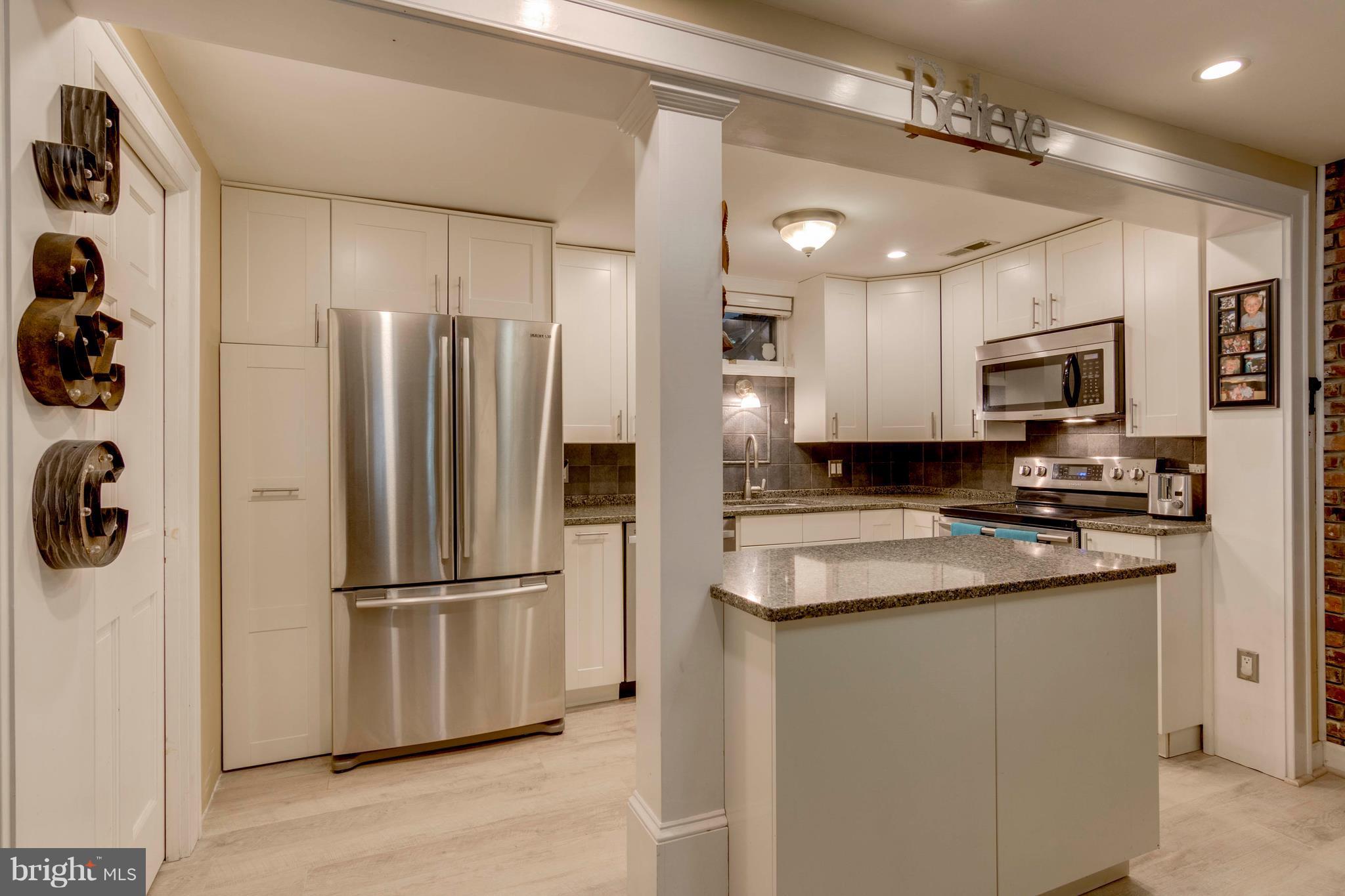 722 Genessee Street Annapolis, MD 21401 - Photo 10 of 29 a kitchen with a refrigerator sink and microwave