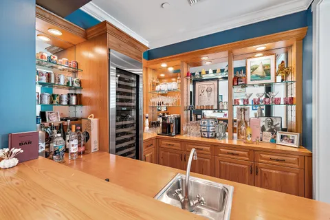 a kitchen with stainless steel appliances a sink and a refrigerator