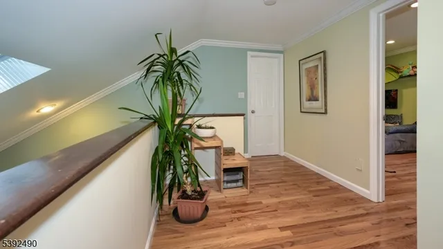 a bedroom with a large bed and a wooden floor