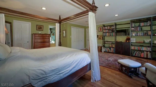 a living room with a large window and furniture