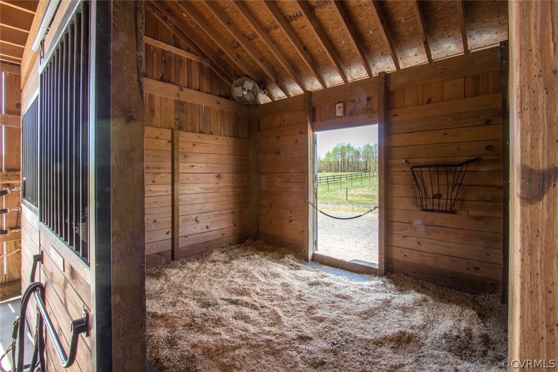 6085 Cartersville Road Powhatan, VA 23139 - Photo 8 of 50 12 x 14 stalls with hay rack and fan.