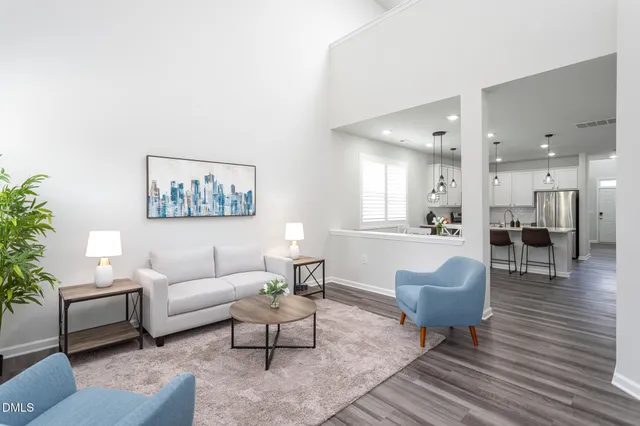 a living room with furniture and a table