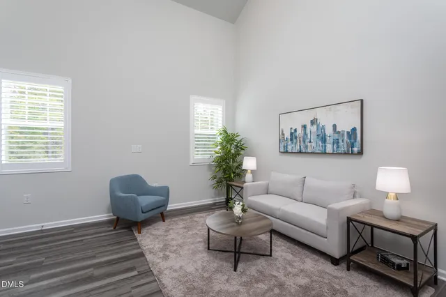 a kitchen with stainless steel appliances white cabinets and a refrigerator