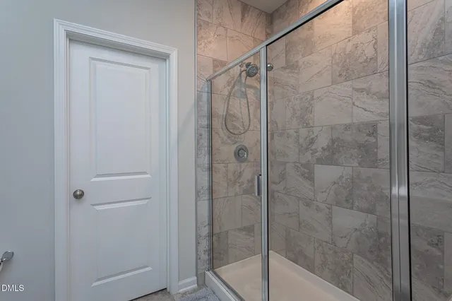 a bathroom with a sink double vanity and a mirror