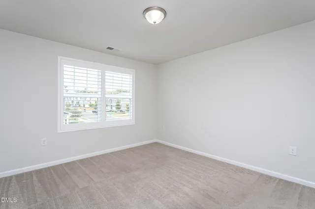 a bathroom with a double vanity sink mirror and shower