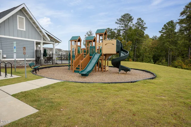 a view of a field with trees in the background