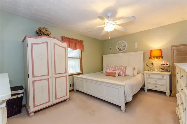 a bathroom with a toilet a sink and curtain