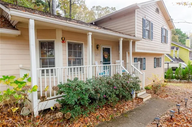 a kitchen with stainless steel appliances kitchen island granite countertop a sink and a stove