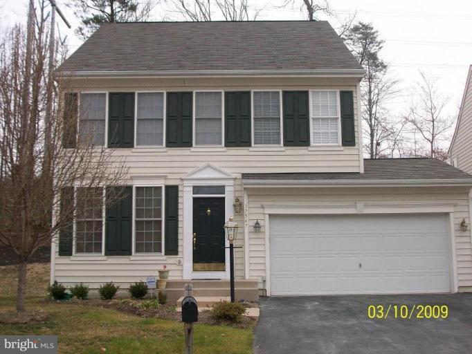 17567 Deweys Run Lane Dumfries, VA 22026 - Photo 1 of 20 a view of a white house with large windows