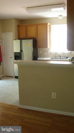 17567 Deweys Run Lane Dumfries, VA 22026 - Photo 13 of 20 a view of kitchen with wooden floor