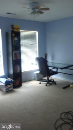 17567 Deweys Run Lane Dumfries, VA 22026 - Photo 15 of 20 a room with furniture and a window