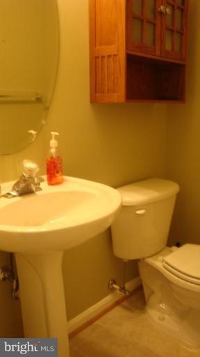 17567 Deweys Run Lane Dumfries, VA 22026 - Photo 18 of 20 a bathroom with a sink and a toilet