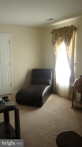 17567 Deweys Run Lane Dumfries, VA 22026 - Photo 10 of 20 a living room with furniture and a window