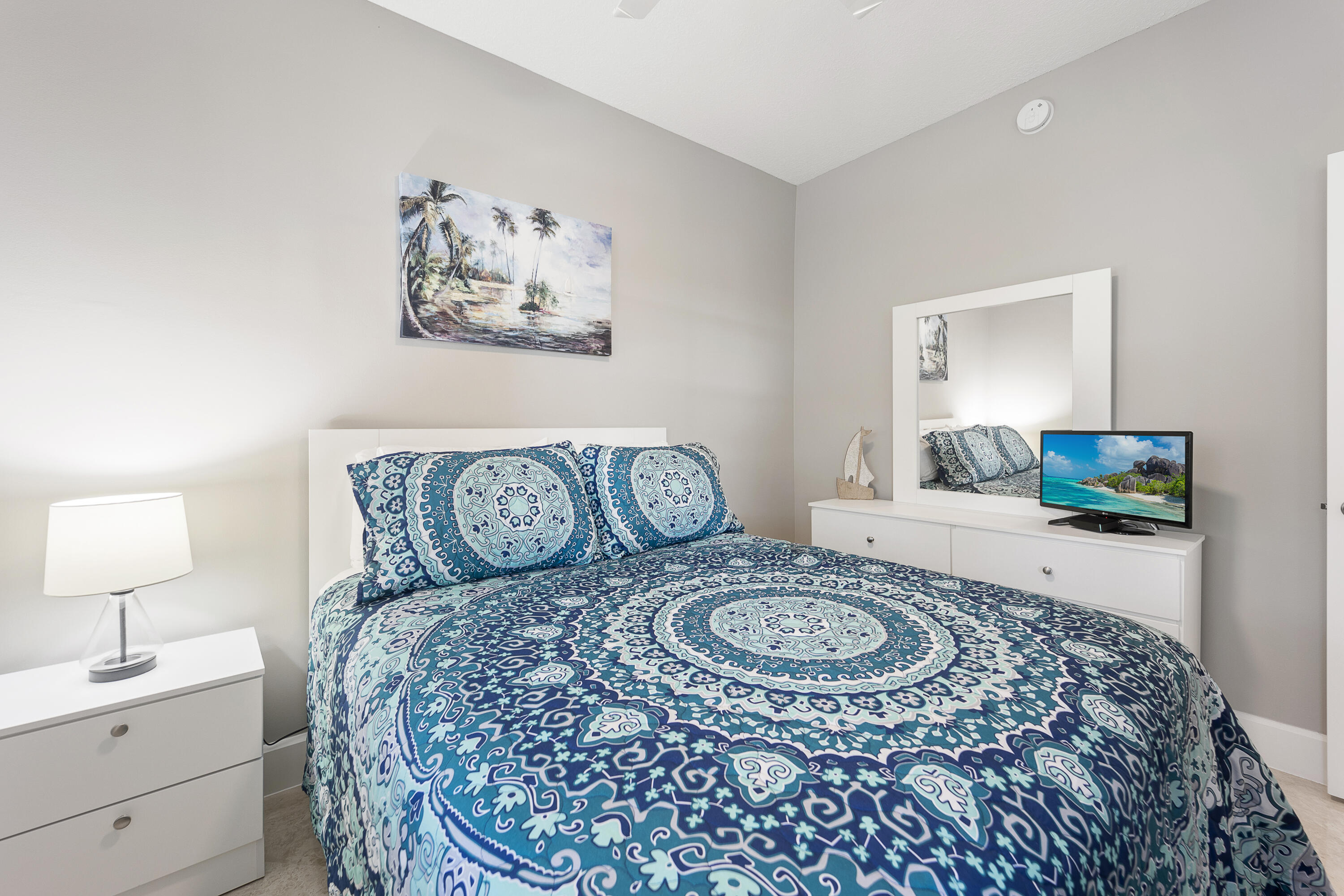 a living room with furniture a couch and a potted plant