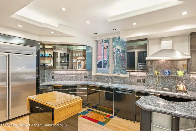 a bathroom with a bathtub and shower