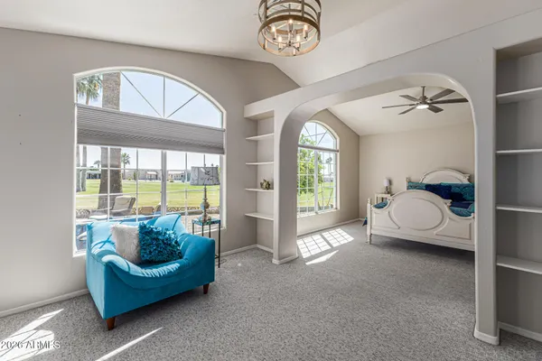 a living room with furniture and a large window