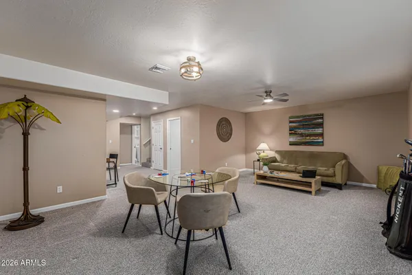 a living room with furniture and a large window