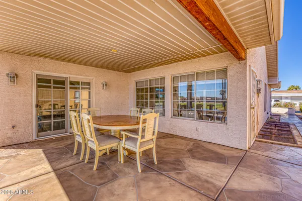 a dining space with table and chairs