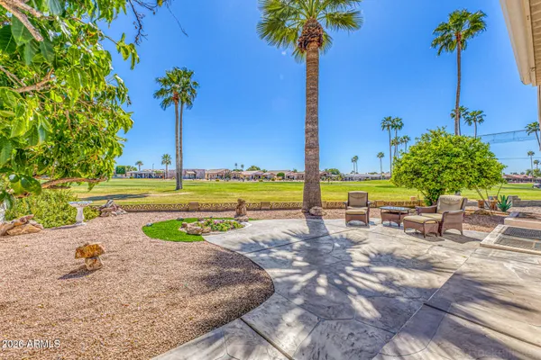 a view of a swimming pool with a table and chairs