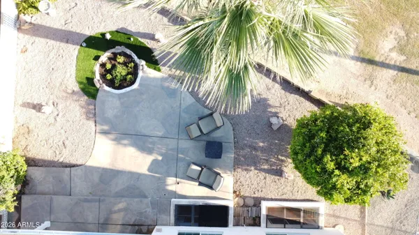 a view of a house with a palm tree