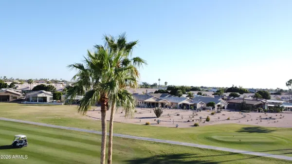 a view of a swimming pool and a yard