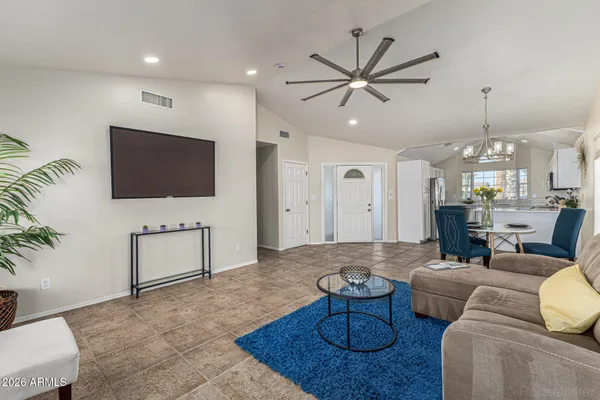 a living room with furniture and a flat screen tv
