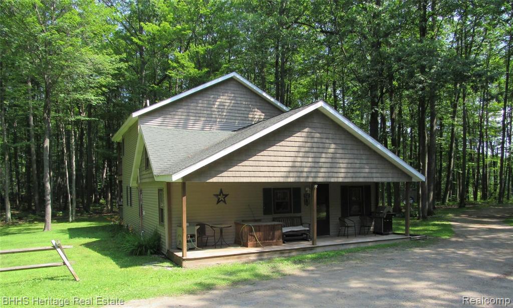 561 Ogemaw Road West Branch, MI 48661 - Photo 1 of 38