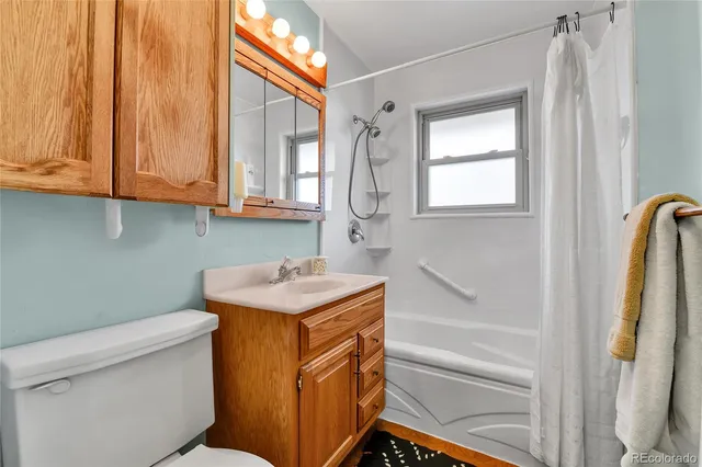 a bathroom with a sink a toilet and a bathtub