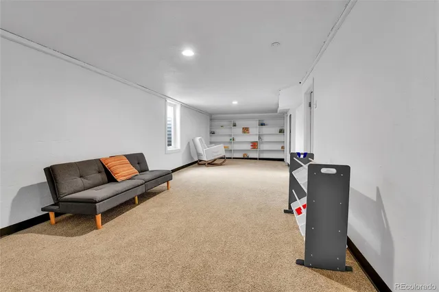 a living room with furniture and a chair