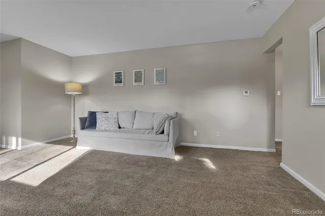 a spacious bedroom with a bed and a couch