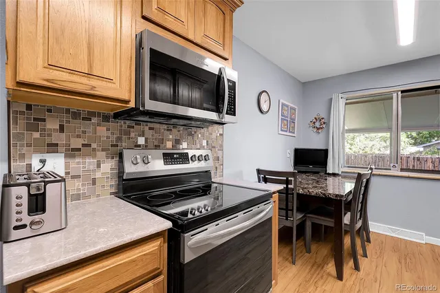 a kitchen with a stove and a microwave