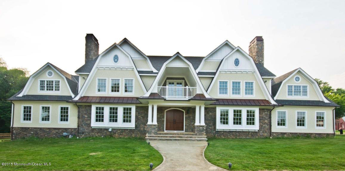51 Phalanx Road Colts Neck, NJ 07722 - Photo 1 of 35 a front view of a house with a yard
