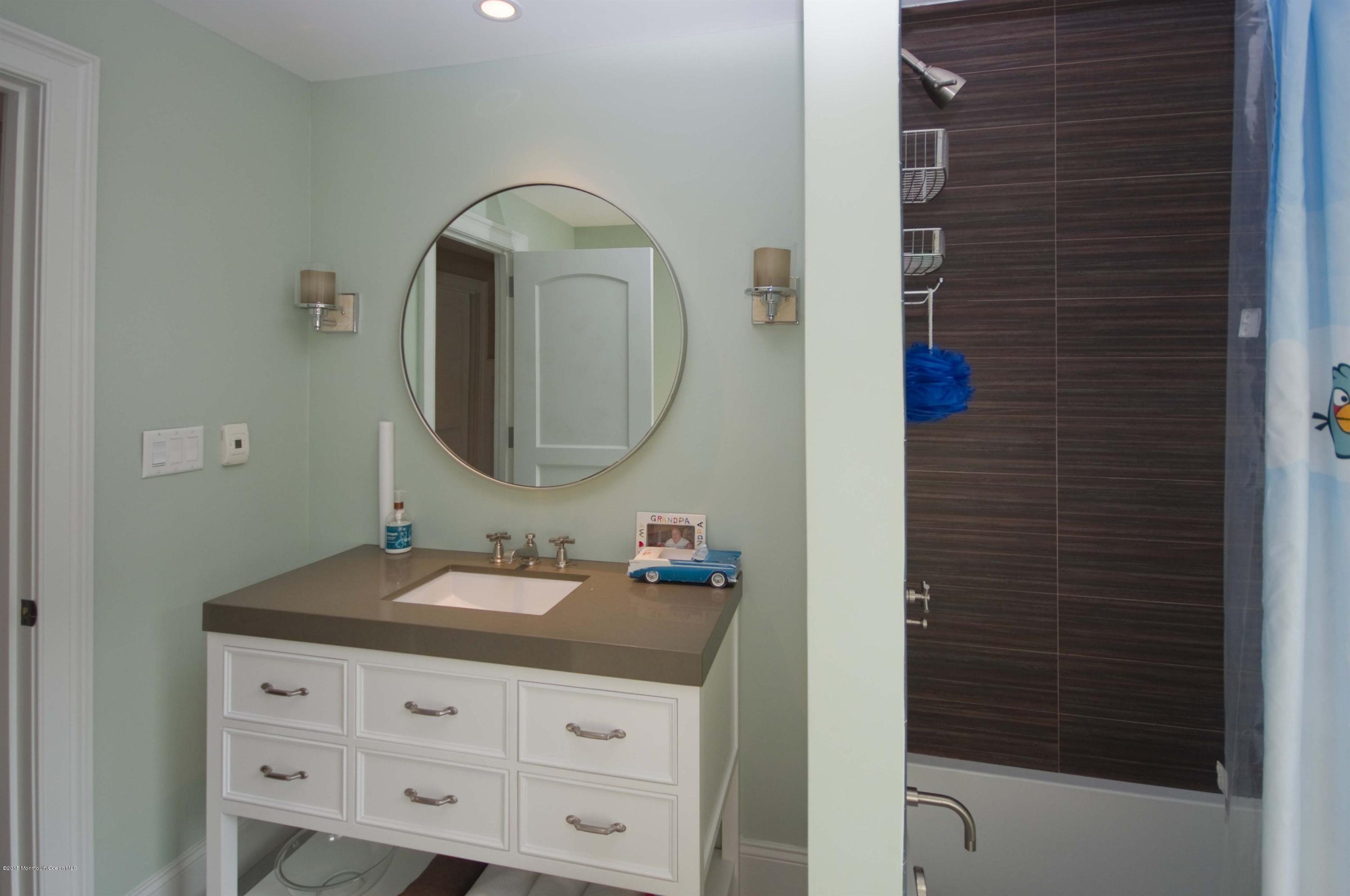 51 Phalanx Road Colts Neck, NJ 07722 - Photo 19 of 35 a bathroom with a sink and a mirror