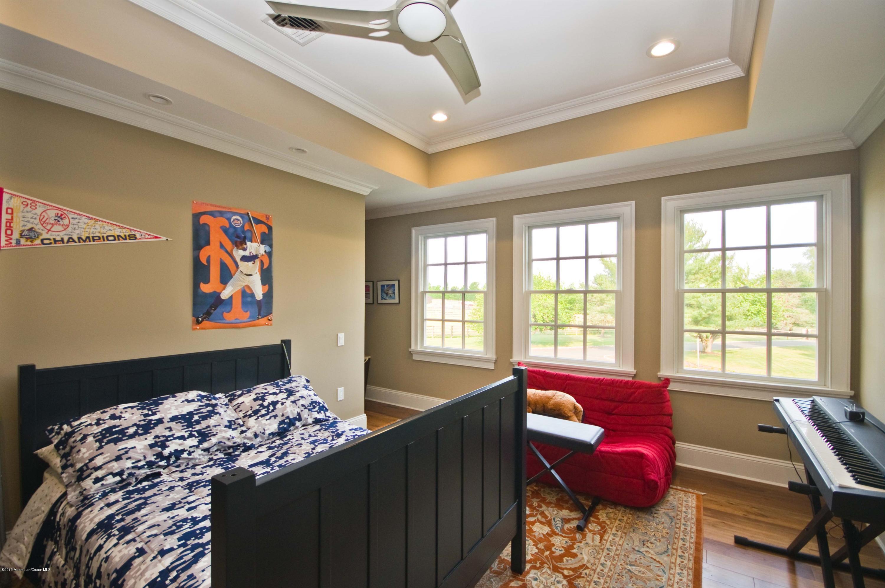 51 Phalanx Road Colts Neck, NJ 07722 - Photo 20 of 35 a living room with furniture and a floor to ceiling window