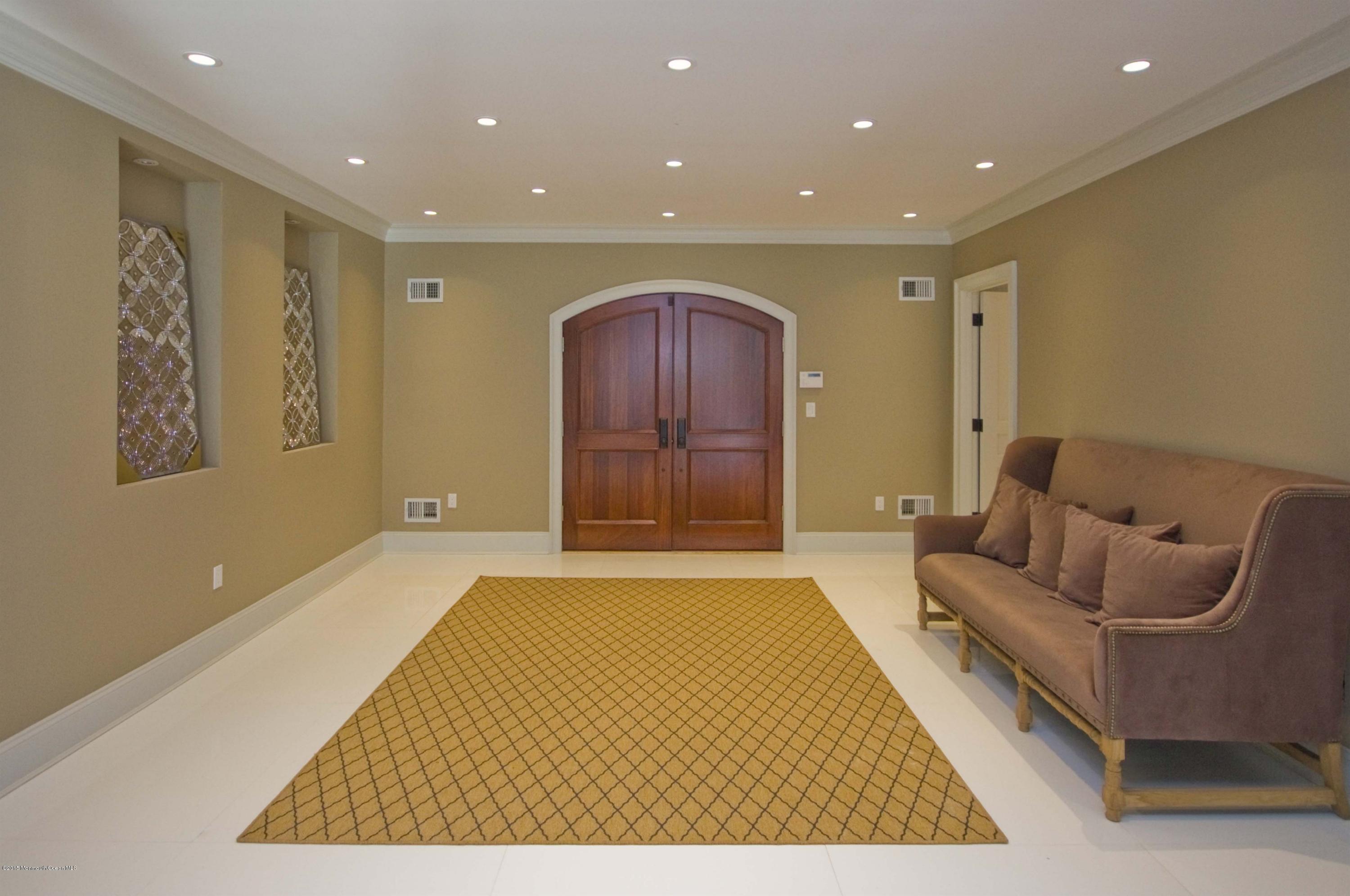 51 Phalanx Road Colts Neck, NJ 07722 - Photo 2 of 35 a living room with furniture and a rug