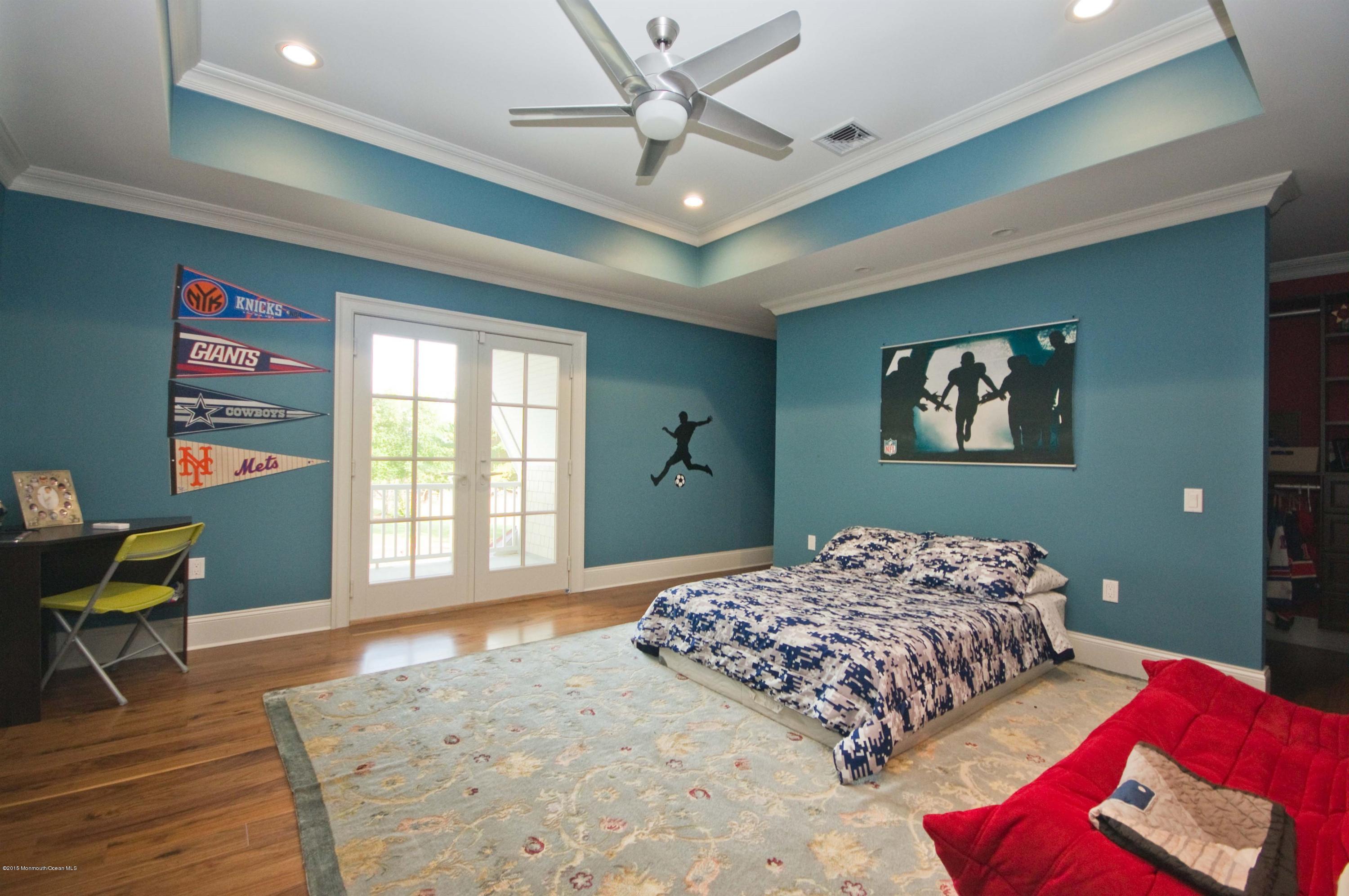 51 Phalanx Road Colts Neck, NJ 07722 - Photo 21 of 35 a bedroom with a large bed and a window