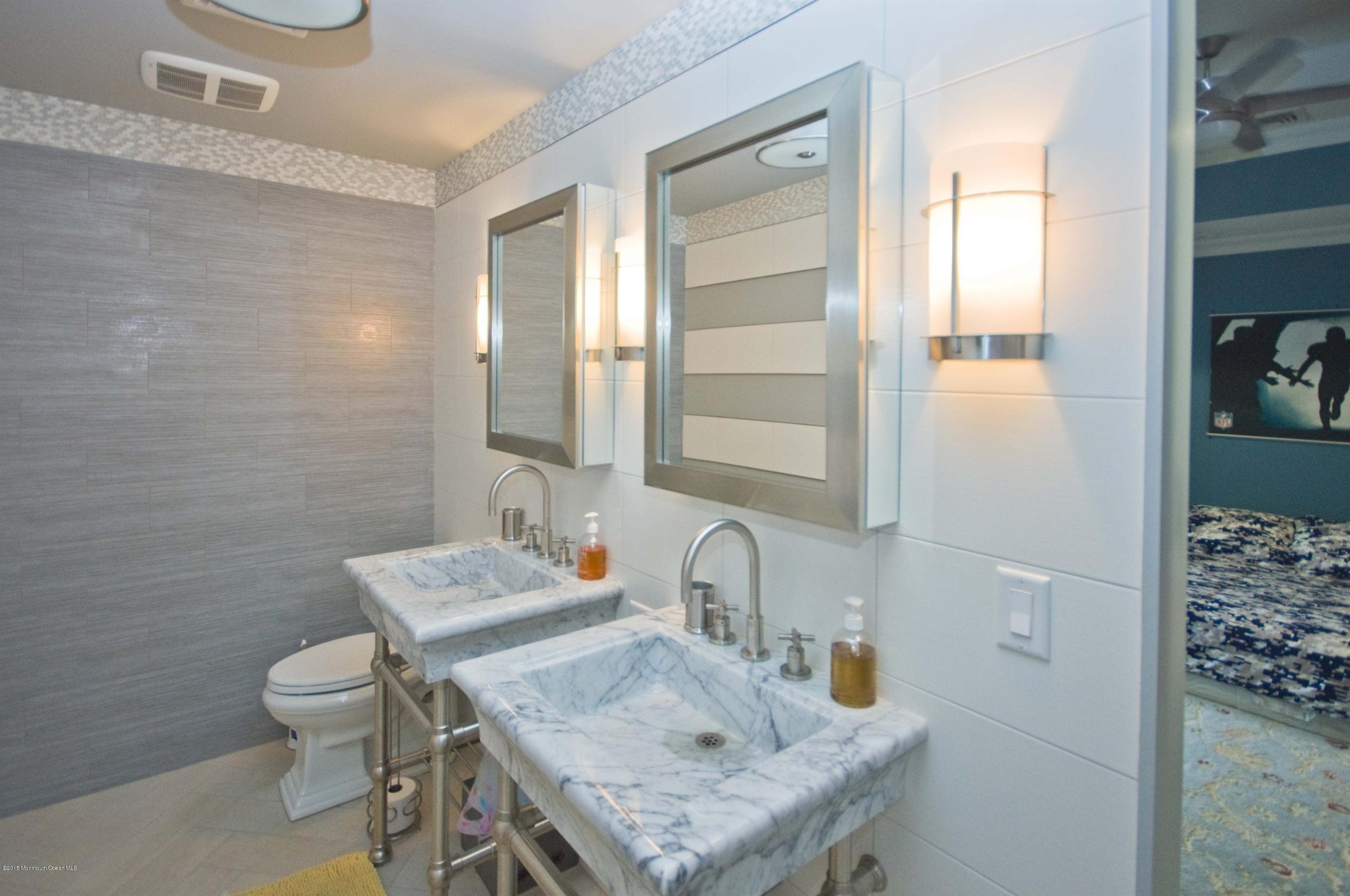 51 Phalanx Road Colts Neck, NJ 07722 - Photo 23 of 35 a bathroom with a sink toilet and shower