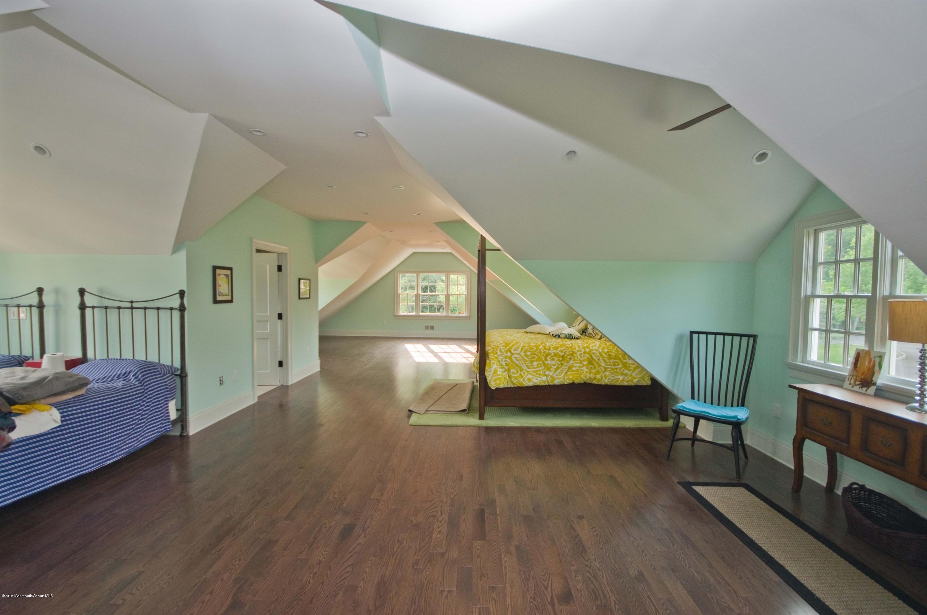 51 Phalanx Road Colts Neck, NJ 07722 - Photo 25 of 35 a view of entryway livingroom and hall with wooden floor