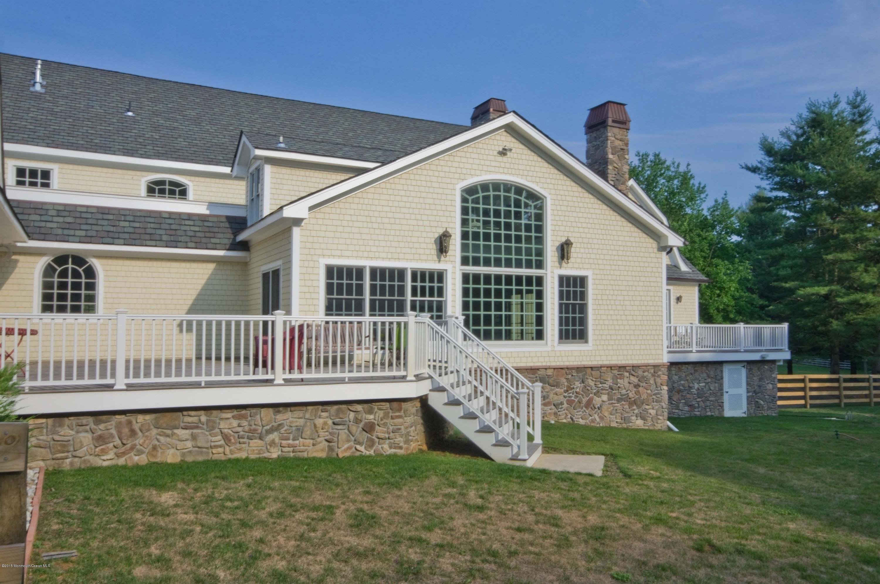 51 Phalanx Road Colts Neck, NJ 07722 - Photo 30 of 35 a view of a house with a yard