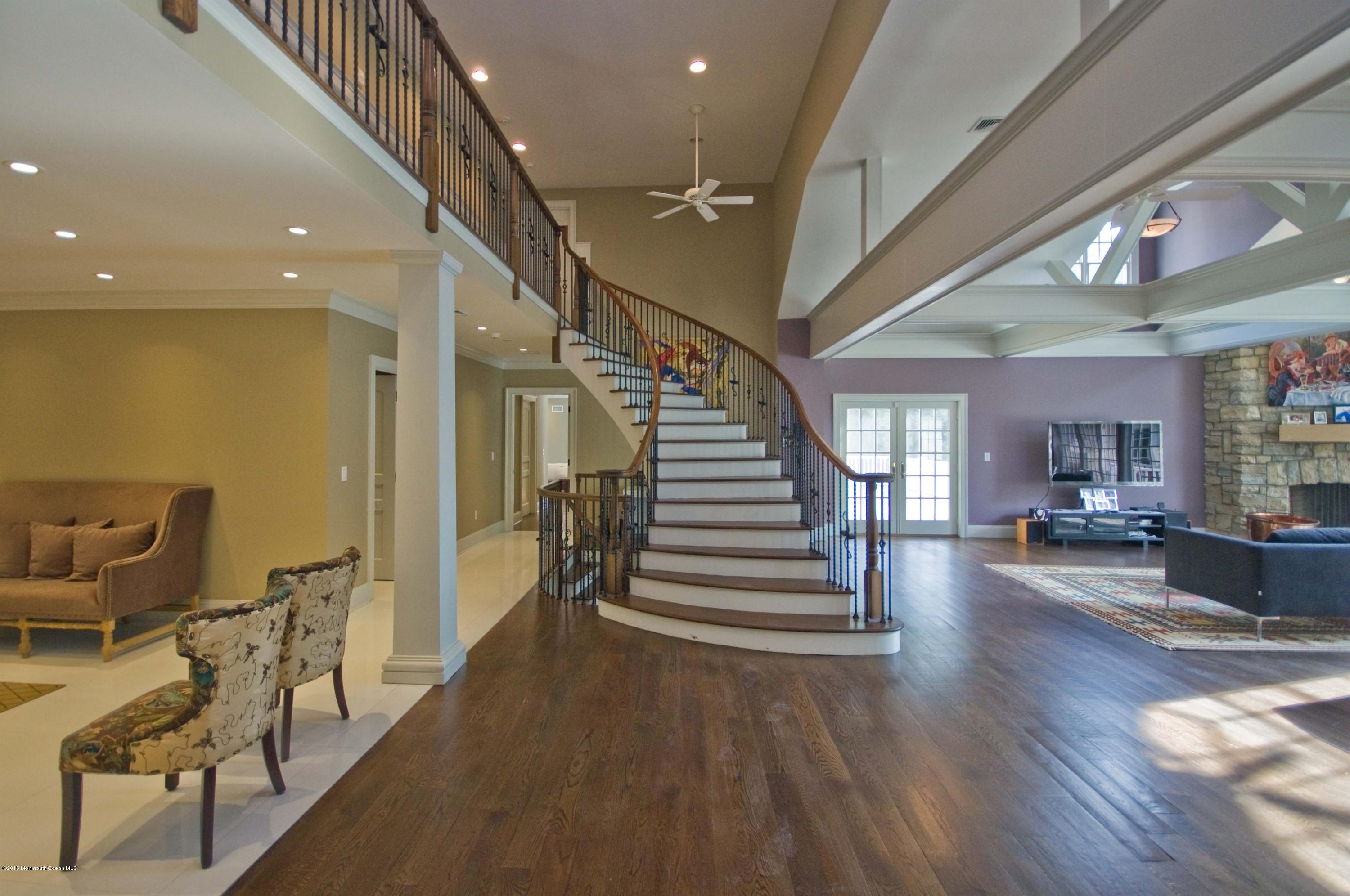 51 Phalanx Road Colts Neck, NJ 07722 - Photo 3 of 35 a view of entryway and hall with wooden floor