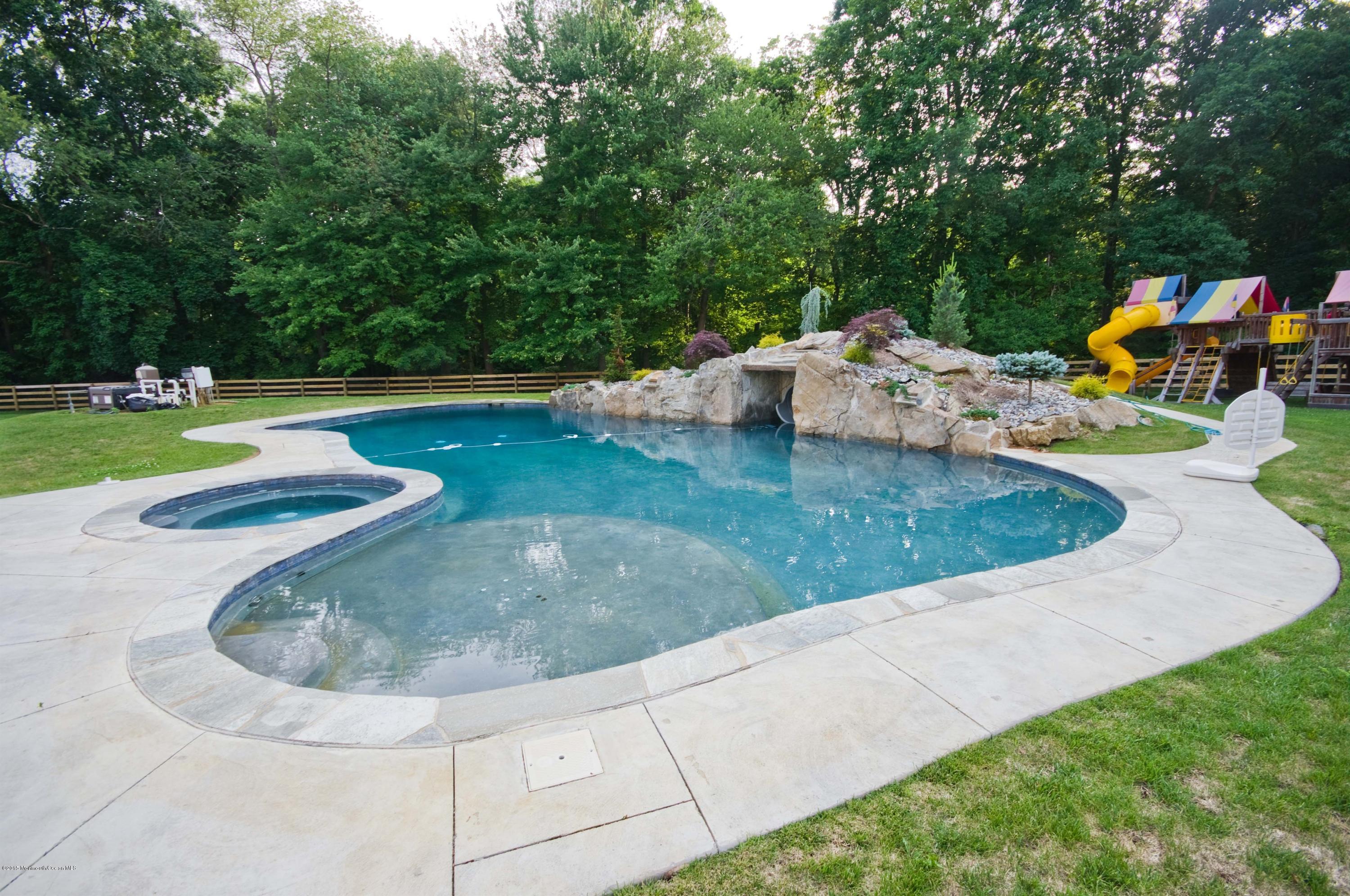 51 Phalanx Road Colts Neck, NJ 07722 - Photo 31 of 35 a view of a backyard with swimming pool